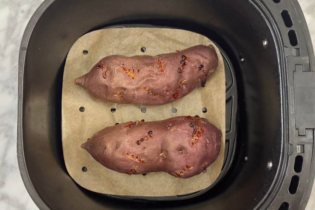 Air fried sweet potatoes in air fryer basket