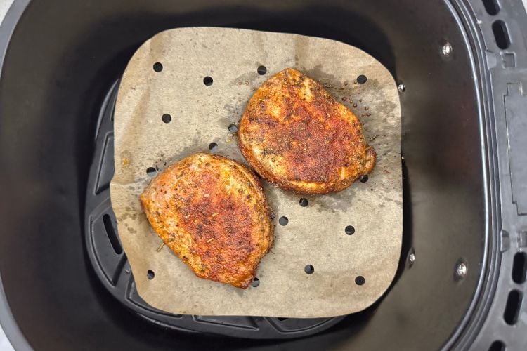 Air fryer pork chops in air fryer basket