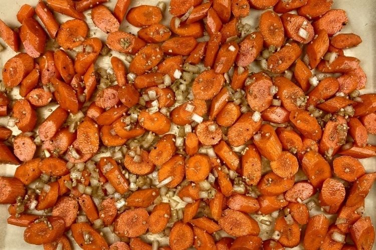All ingredients on a sheet pan for this roasted carrot ginger soup