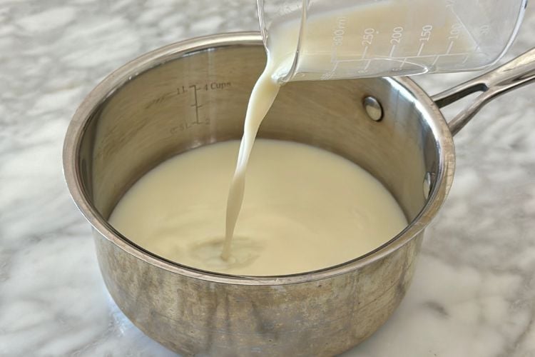 Almond milk in saucepan