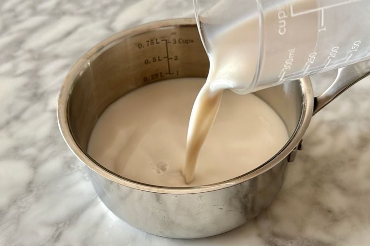 Almond milk in saucepan