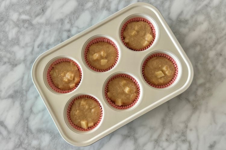 Apple cinnamon muffins in muffin pan