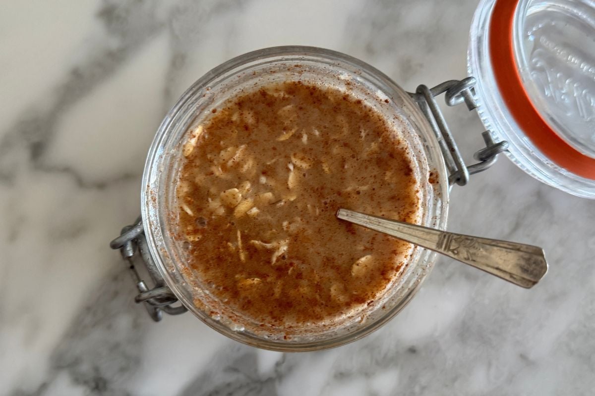 Apple pie overnight oats mixed in a jar