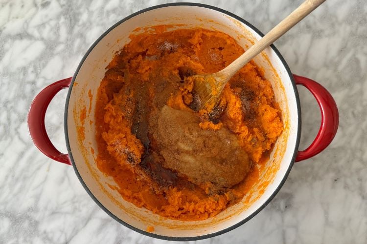 Applesauce and spices in mashed sweet potatoes