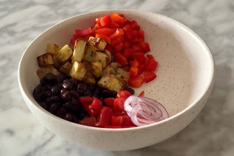 Assemble breakfast burrito bowl