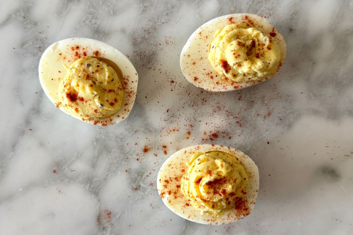 Assembled cottage cheese deviled eggs garnished with paprika
