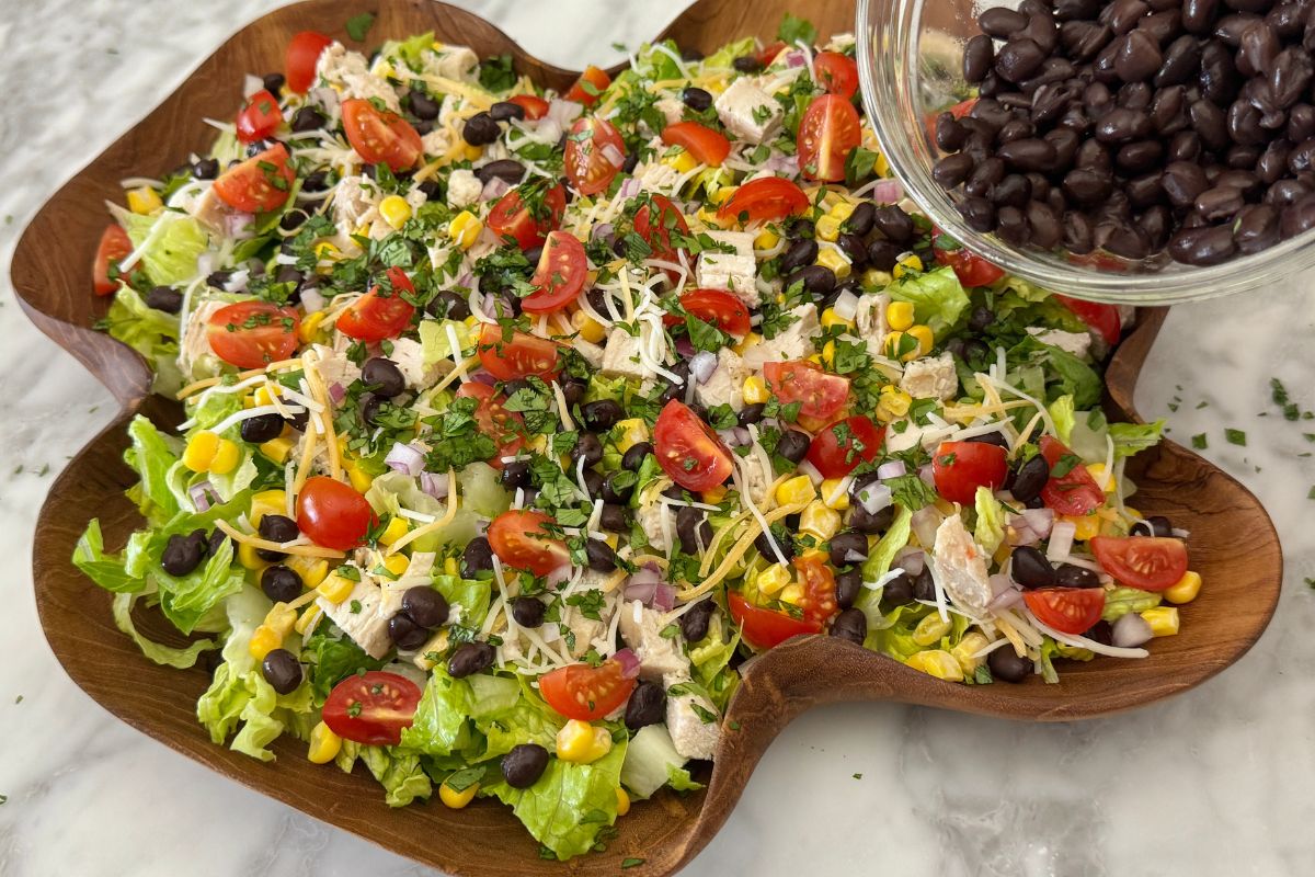 BBQ chicken salad ingredients in a bowl