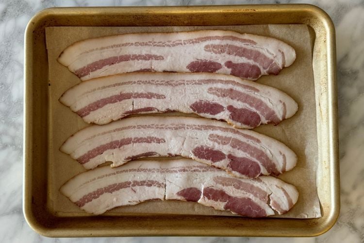 Bacon slices on sheet pan