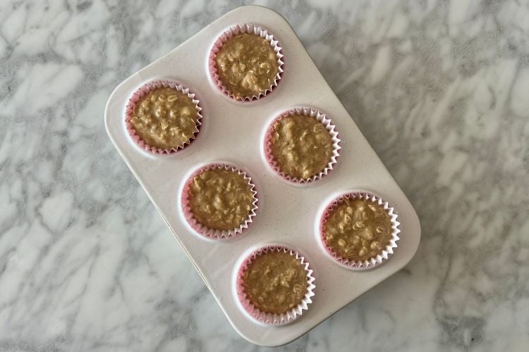 Banana oat muffin batter in muffin pan