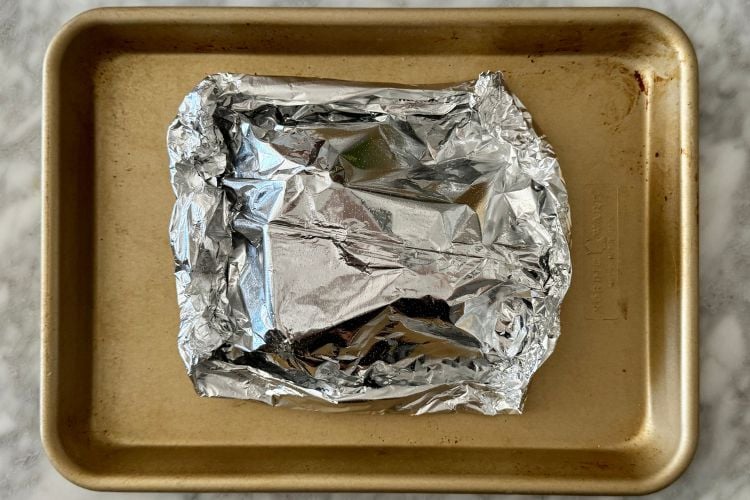 Beets wrapped in foil on sheet pan