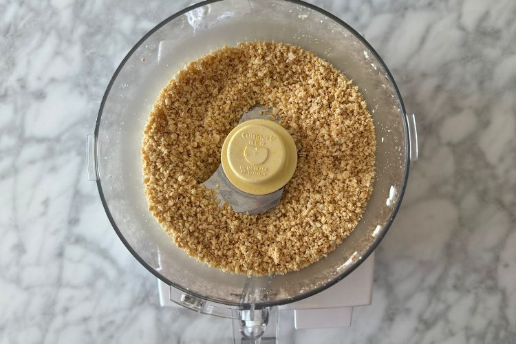 Blended cashews and coconut in food processor