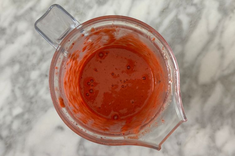 Blended strawberry vinaigrette in blender