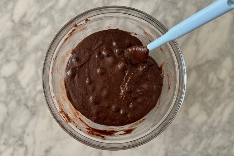 Blueberries folded into muffin batter
