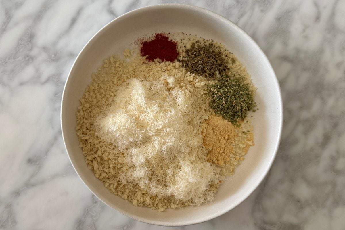 Breadcrumb mixture in bowl for chicken parmesan