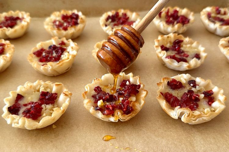 Brie phyllo cups drizzled with honey
