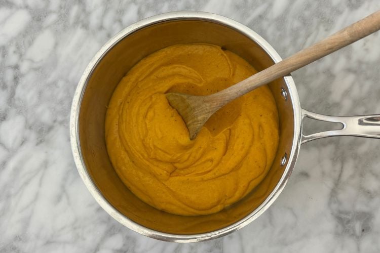 Butternut squash mac and cheese sauce in saucepan