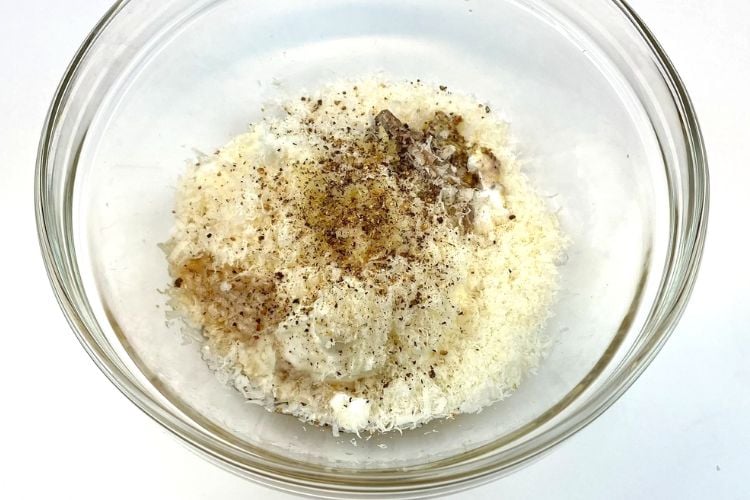 Caesar dressing ingredients in bowl