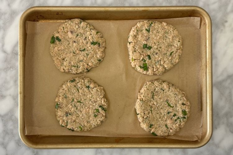 Canned salmon patties on baking sheet