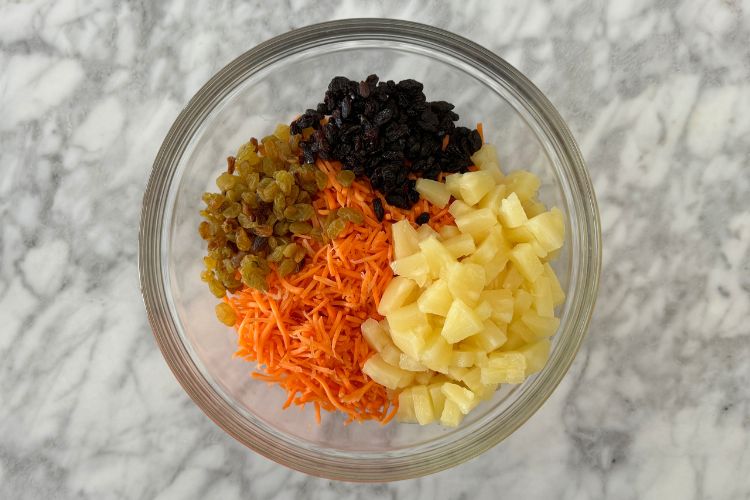 Carrot pineapple raisin salad in bowl