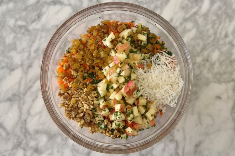 Carrot salad ingredients in a bowl