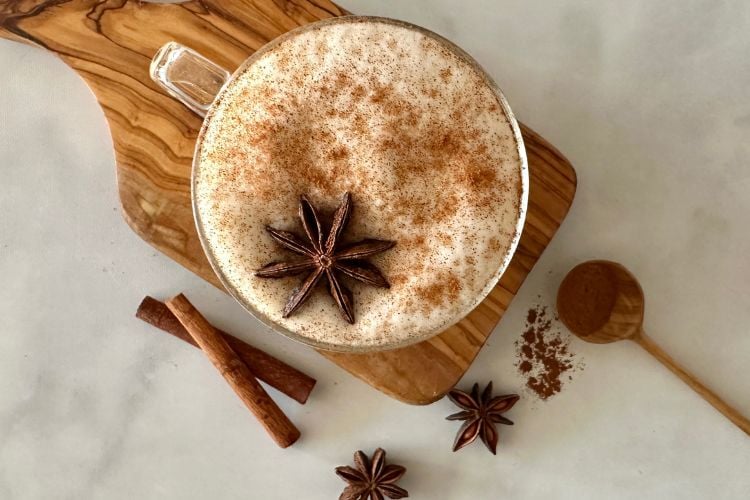 Chai tea latte in cup with frothy milk