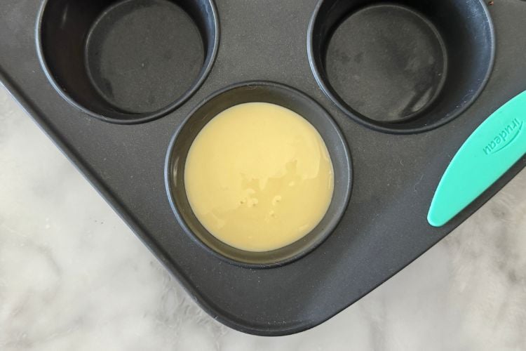 Cheesecake batter in muffin tin