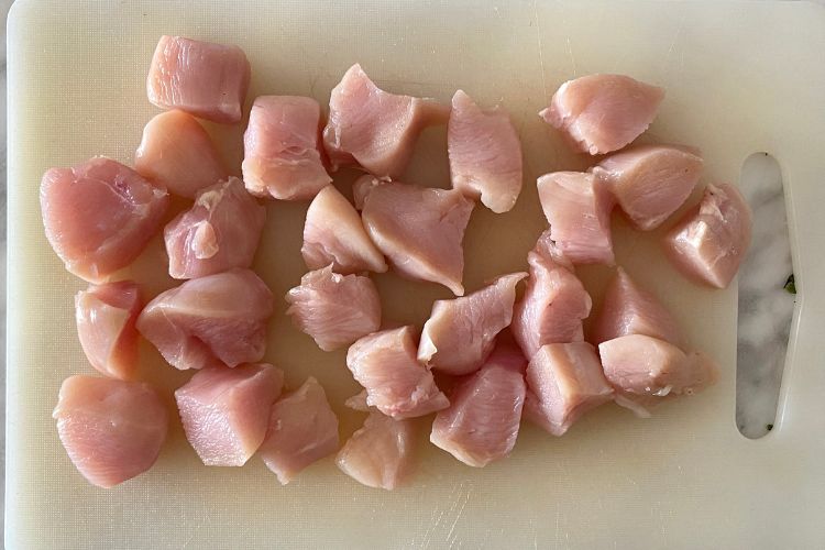 Chicken bites on cutting board