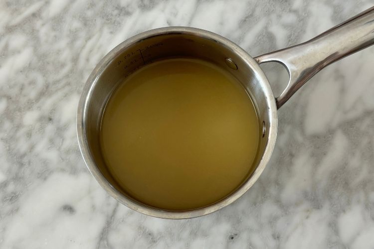 Chicken broth in saucepan
