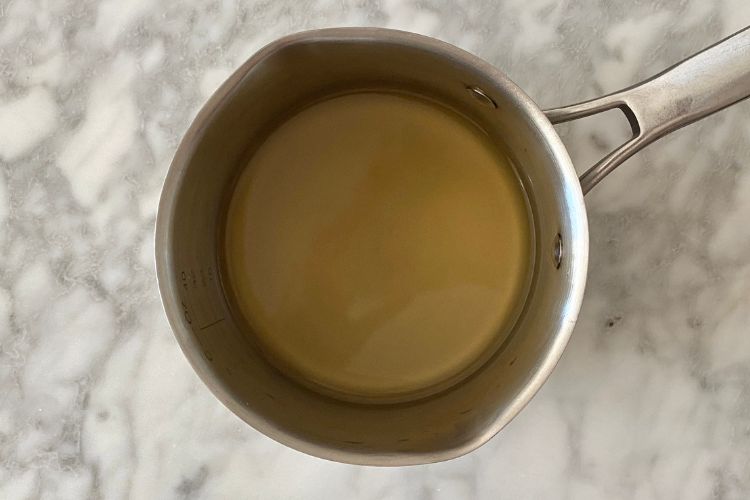Chicken broth in saucepan