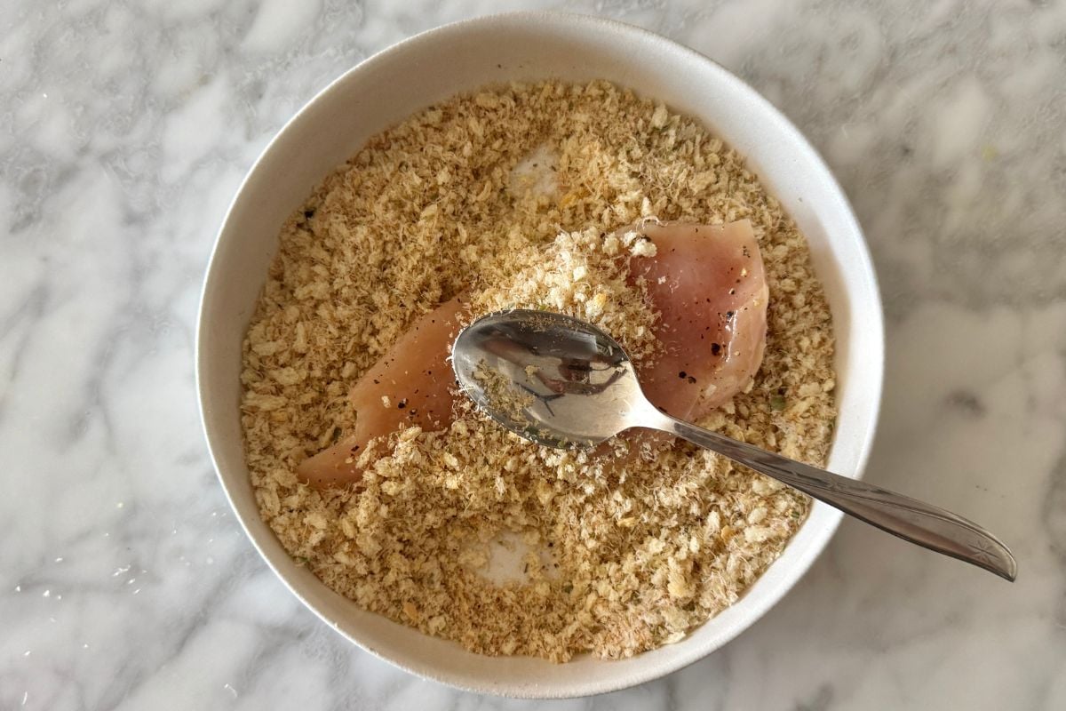 Chicken cutlet in breadcrumb mixture for chicken parmesan