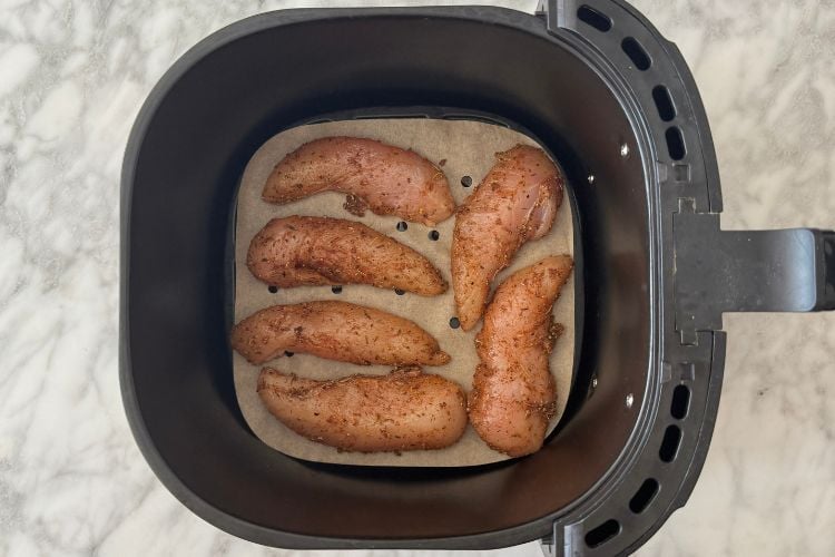 Chicken tenders in the air fryer basket
