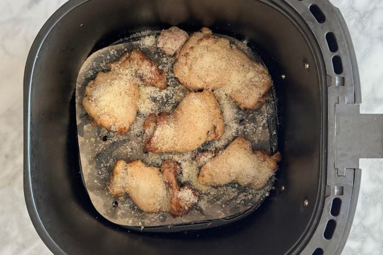 Chicken thighs with grated parmesan cheese