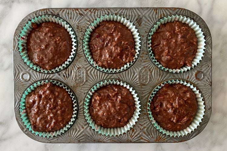 Chocolate cranberry muffins in muffin pan
