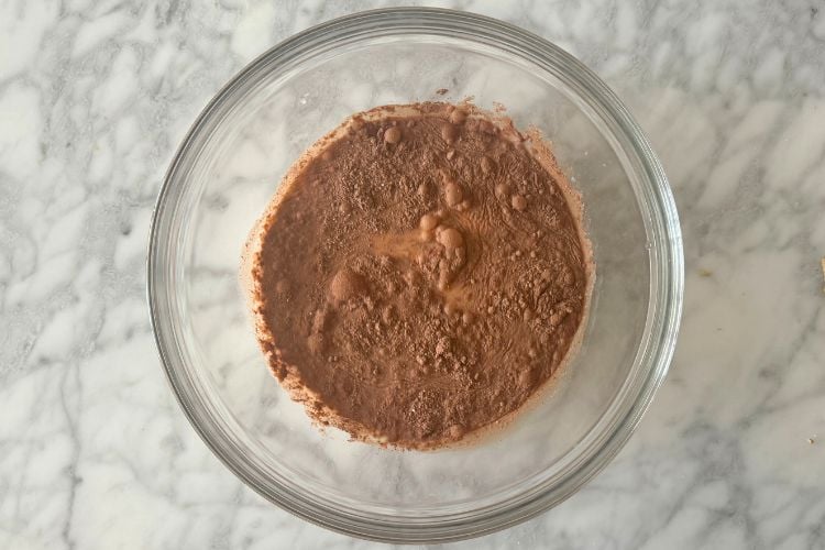 Chocolate instant pudding mix in bowl with milk
