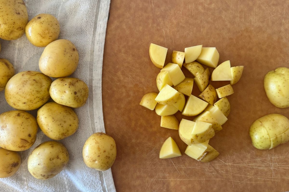 Chopped Yukon Gold potatoes on a cutting board