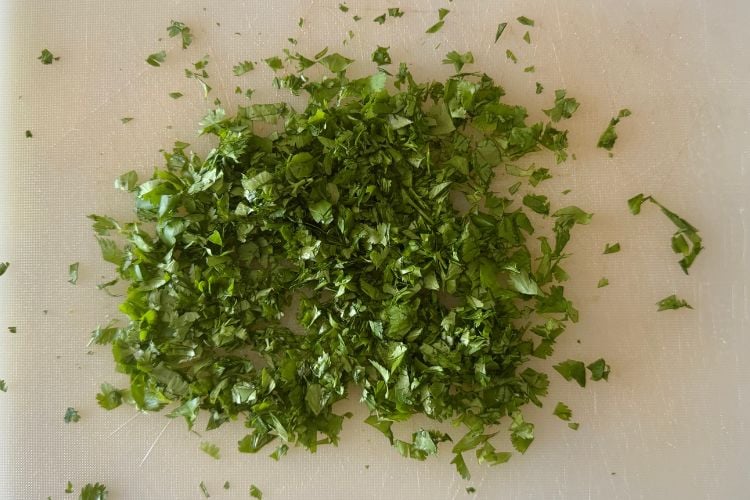 Chopped cilantro on cutting board