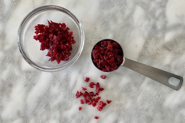 Chopped dried cranberries in bowl