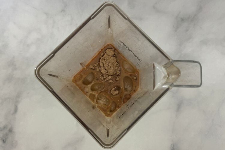 Coffee milk and protein powder in blender