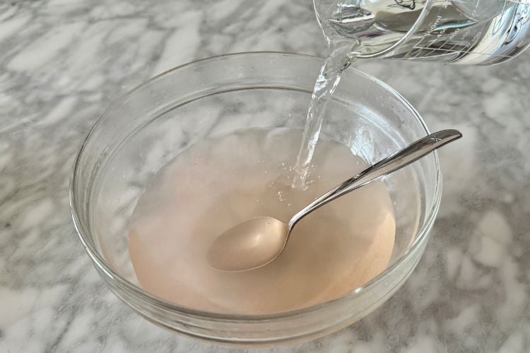Cold water in bowl with warm water