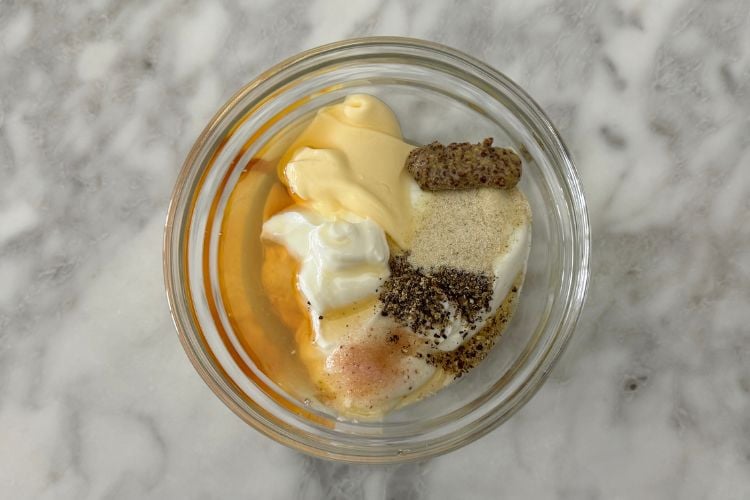 Coleslaw dressing ingredients in bowl