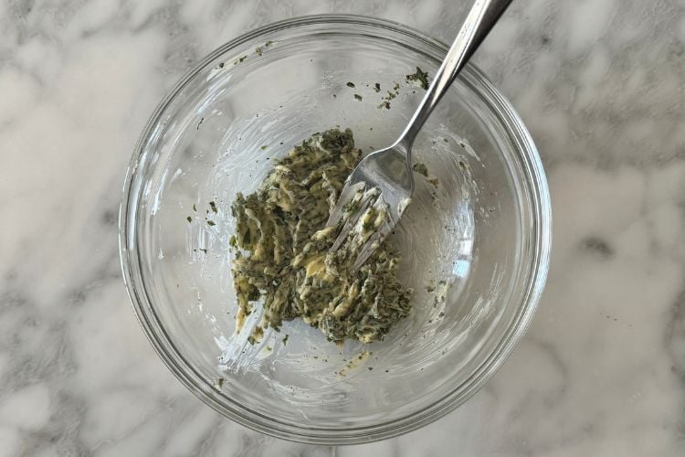 Combined herbed butter in bowl