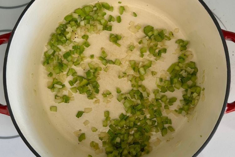Cooked celery and onion in Dutch oven
