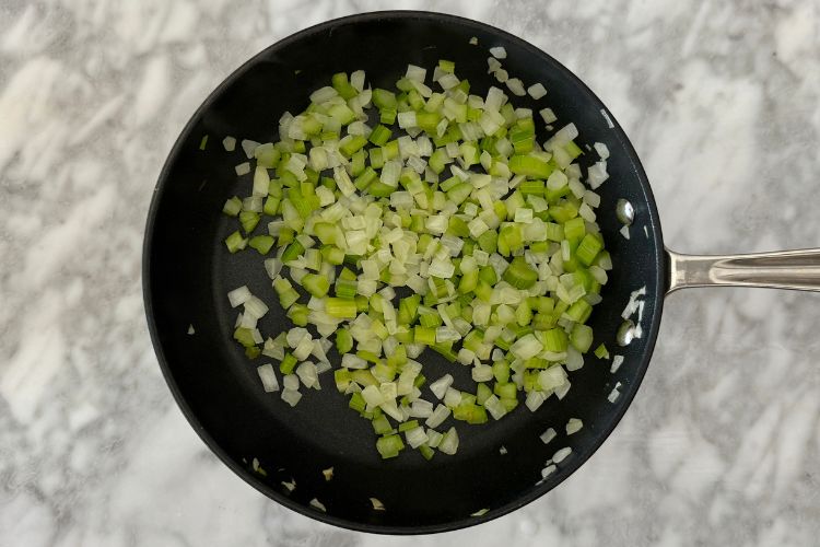 Cooked celery and onion in skillet