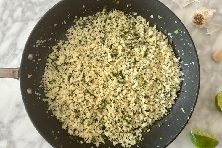 Cooked cilantro lime cauliflower rice in pan