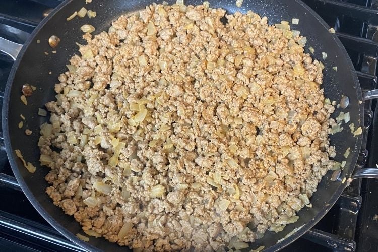 Cooked ground chicken in pan