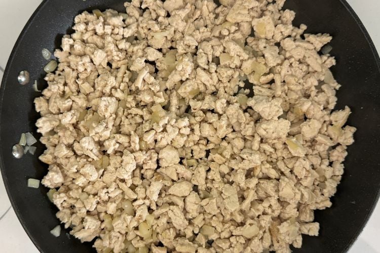 Cooked ground turkey in a skillet