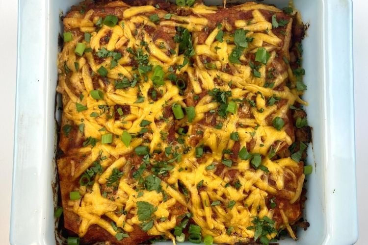 Cooked healthy chicken and cheese enchiladas