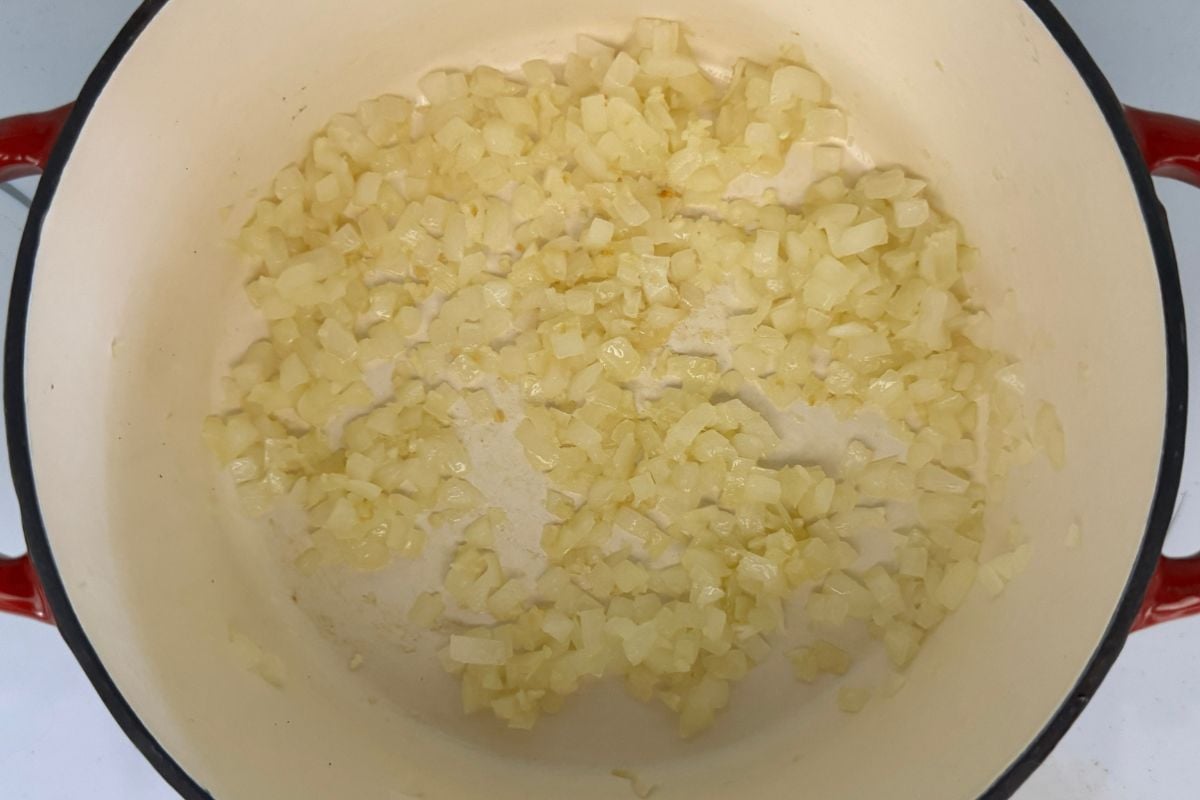 Cooked onions and garlic in a Dutch oven