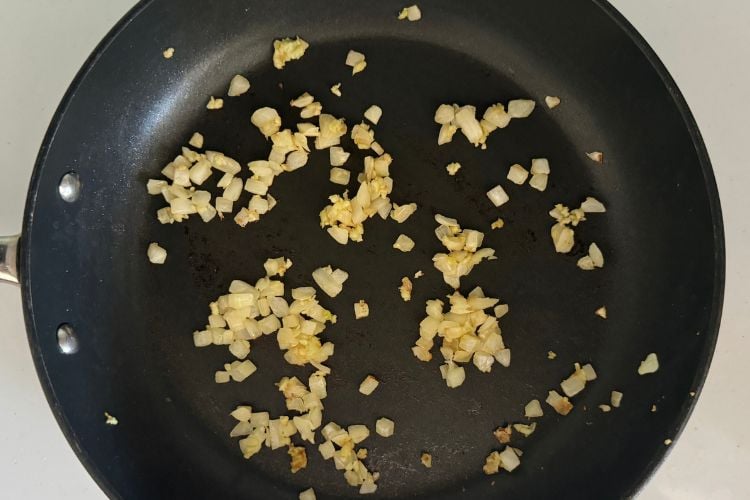 Cooked onions and garlic in pan