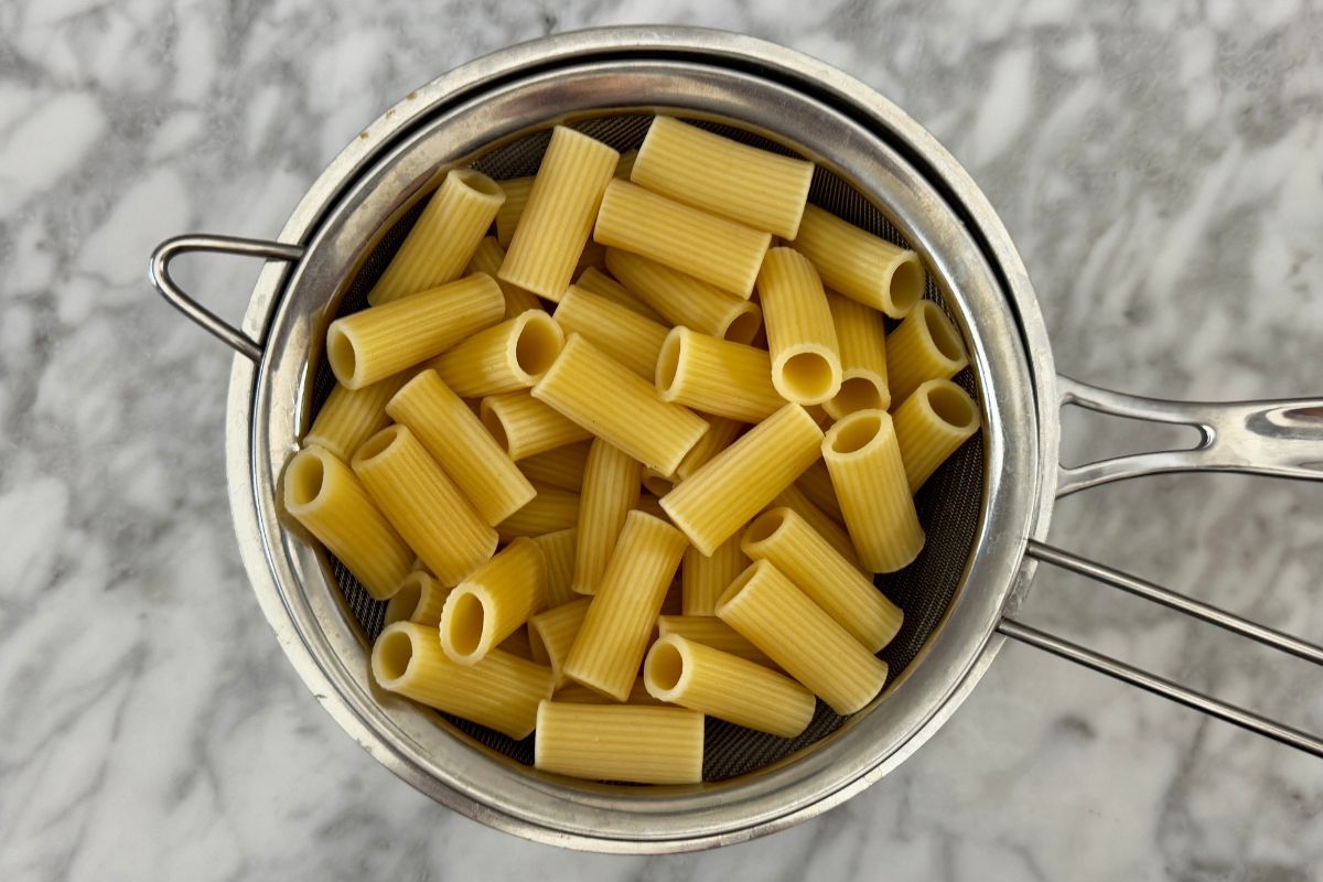 Cooked pasta in a strainer